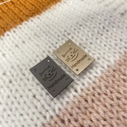 Sewn-on eco-leather tag, 2x3cm
